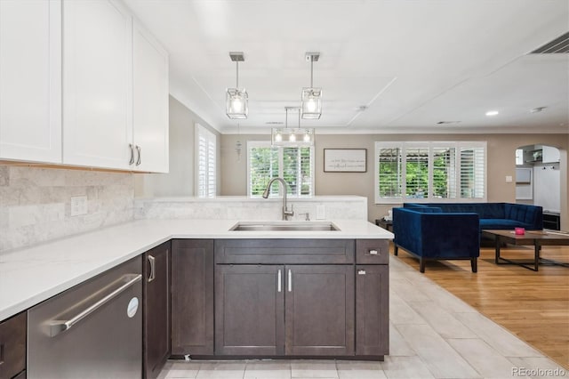 2664 Forest St, Denver, CO 80207 - kitchen with a sink, white cabinets, dishwasher, light countertops, and open floor plan