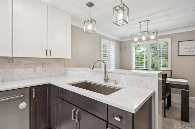 2664 Forest St, Denver, CO 80207 - kitchen with a sink, dark brown cabinets, a peninsula, white cabinets, and backsplash