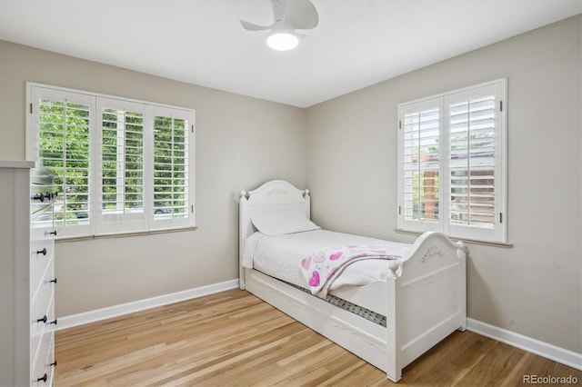 2664 Forest St, Denver, CO 80207 - bedroom featuring wood finished floors and baseboards