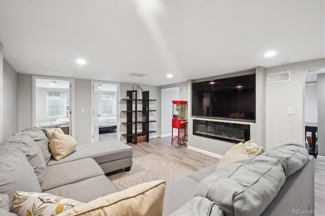 2664 Forest St, Denver, CO 80207 - living area with wood finished floors, recessed lighting, and baseboards