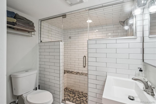 2664 Forest St, Denver, CO 80207 - bathroom featuring a sink, a shower stall, and toilet