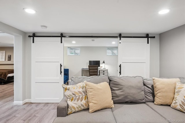 2664 Forest St, Denver, CO 80207 - living room with a barn door, light wood finished floors, and recessed lighting