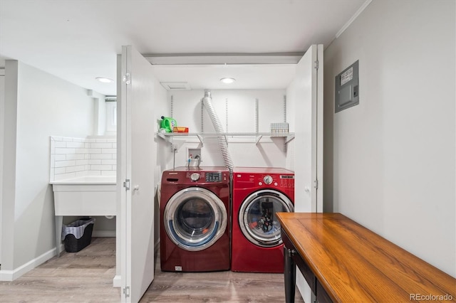 2664 Forest St, Denver, CO 80207 - laundry area with washing machine and clothes dryer, wood finished floors, electric panel, baseboards, and recessed lighting