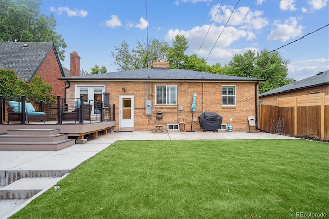 2664 Forest St, Denver, CO 80207 - rear view of property featuring a patio, a wooden deck, brick siding, a chimney, and french doors