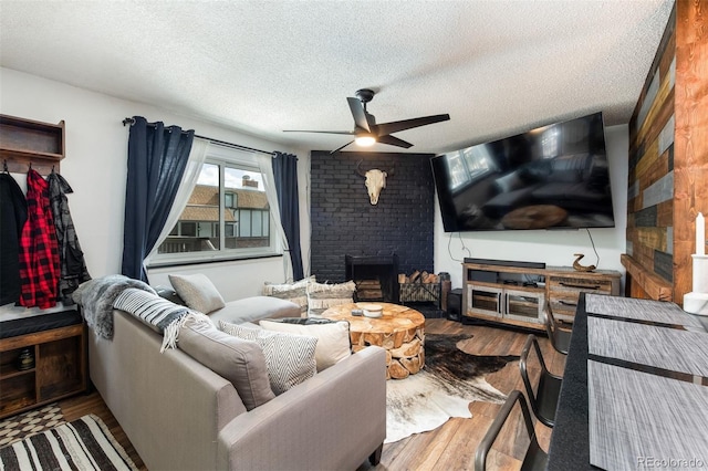 2700 S Holly St Unit 202, Denver, CO 80222 - living area with ceiling fan, wood finished floors, and a textured ceiling