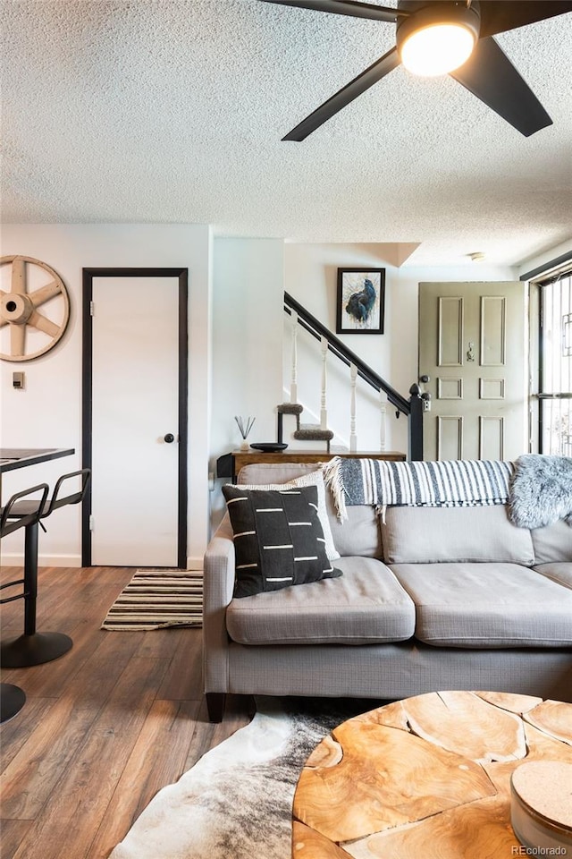 2700 S Holly St Unit 202, Denver, CO 80222 - living room with a textured ceiling, a ceiling fan, and wood-type flooring