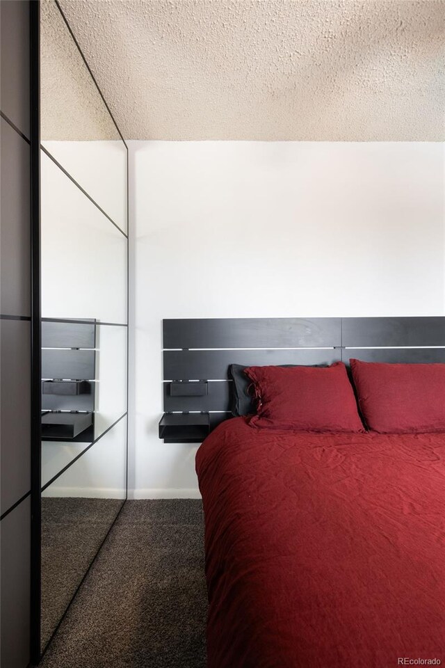 2700 S Holly St Unit 202, Denver, CO 80222 - carpeted bedroom with a textured ceiling