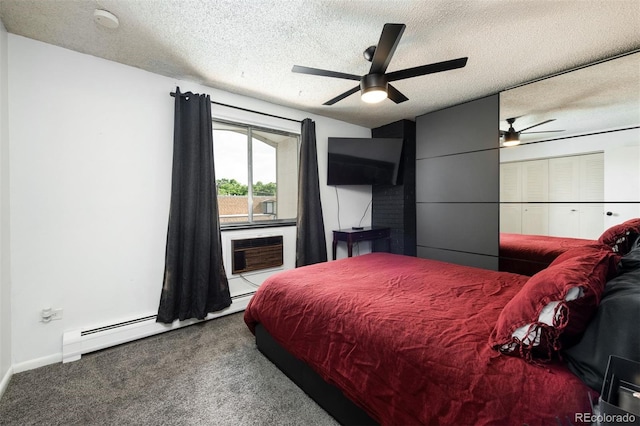 2700 S Holly St Unit 202, Denver, CO 80222 - carpeted bedroom with a textured ceiling, a baseboard heating unit, a wall mounted air conditioner, and a ceiling fan