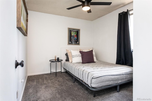 2700 S Holly St Unit 202, Denver, CO 80222 - bedroom with dark carpet and a ceiling fan