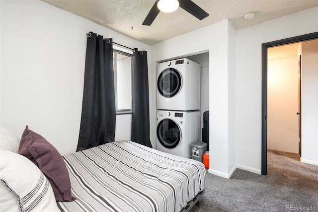 2700 S Holly St Unit 202, Denver, CO 80222 - carpeted bedroom with stacked washing machine and dryer, a textured ceiling, and a ceiling fan