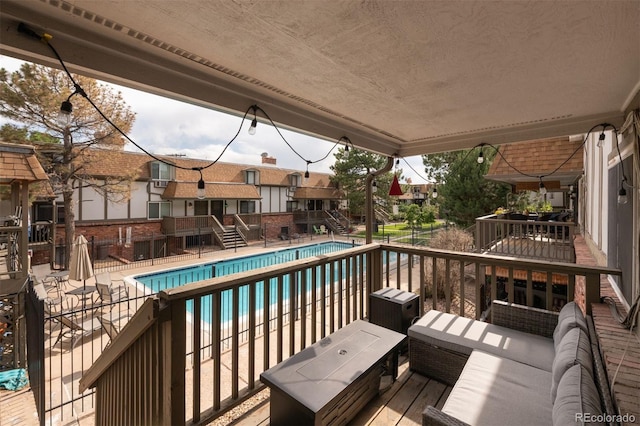 2700 S Holly St Unit 202, Denver, CO 80222 - wooden deck with stairs and a community pool