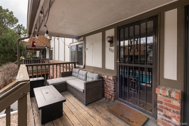 2700 S Holly St Unit 202, Denver, CO 80222 - deck featuring an outdoor living space