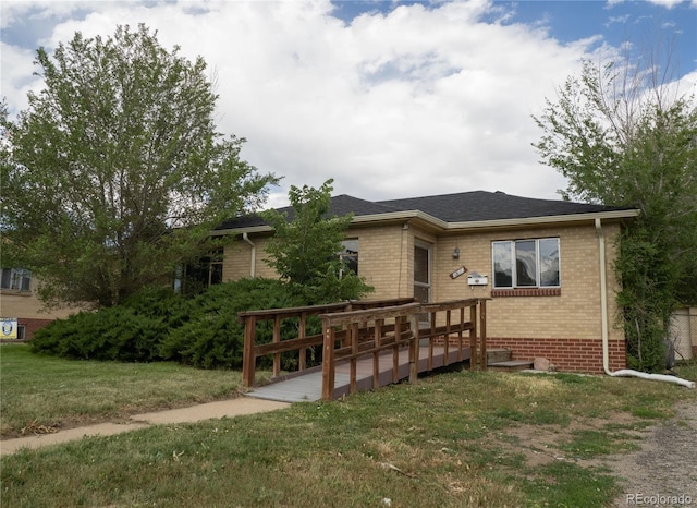 3820-3830 Pierce St, Wheat Ridge, CO 80033 - view of front of property with a deck, brick siding, a front lawn, and roof with shingles