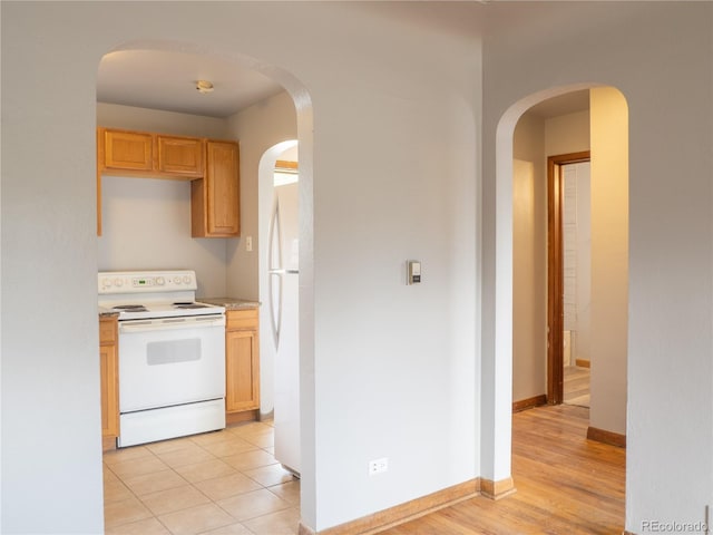 3820-3830 Pierce St, Wheat Ridge, CO 80033 - kitchen with white appliances and light countertops