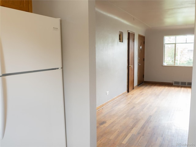 3820-3830 Pierce St, Wheat Ridge, CO 80033 - spare room featuring light wood finished floors and baseboards