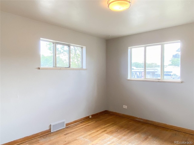 3820-3830 Pierce St, Wheat Ridge, CO 80033 - spare room featuring healthy amount of natural light and light wood finished floors