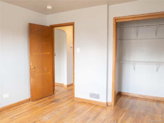 3820-3830 Pierce St, Wheat Ridge, CO 80033 - unfurnished bedroom with a closet and light wood-style floors