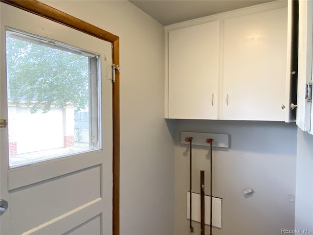 3820-3830 Pierce St, Wheat Ridge, CO 80033 - laundry area featuring cabinet space