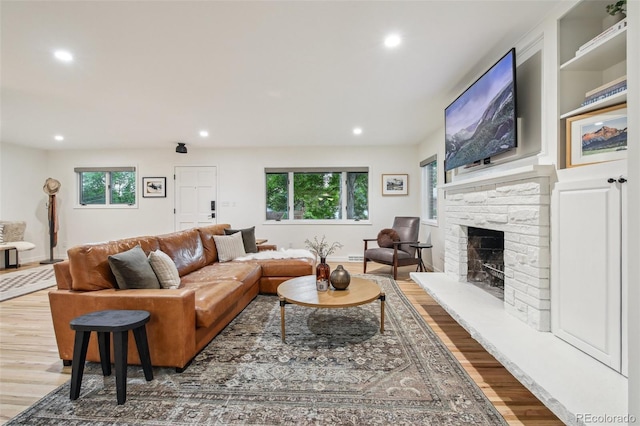 632 Wyoming St, Golden, CO 80403 - living area with wood finished floors, plenty of natural light, recessed lighting, and a fireplace with raised hearth