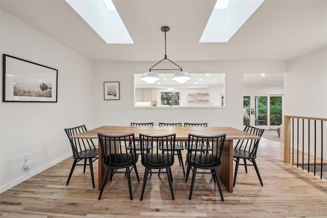632 Wyoming St, Golden, CO 80403 - dining area with a skylight, light wood-style flooring, and baseboards