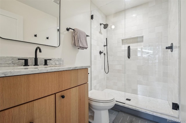 632 Wyoming St, Golden, CO 80403 - bathroom featuring vanity, a stall shower, and toilet