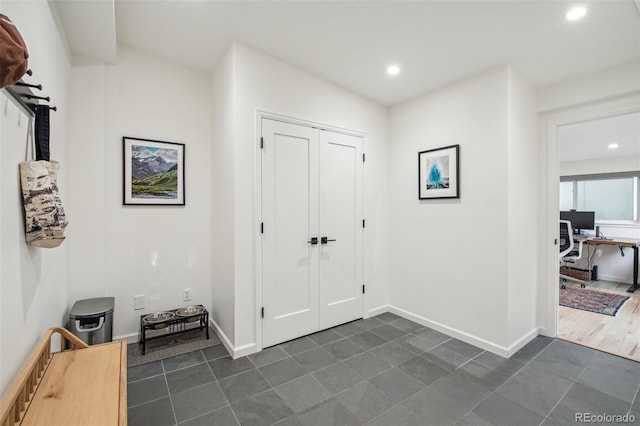 632 Wyoming St, Golden, CO 80403 - foyer with dark tile patterned floors, recessed lighting, and baseboards