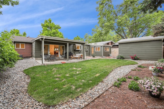 632 Wyoming St, Golden, CO 80403 - back of house with a lawn and a patio area