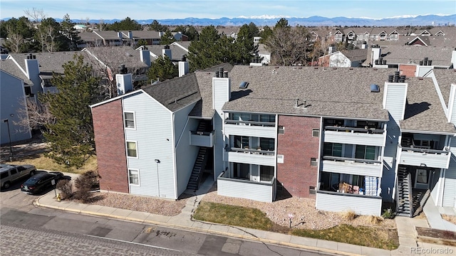 aerial view with a mountain view and a residential view