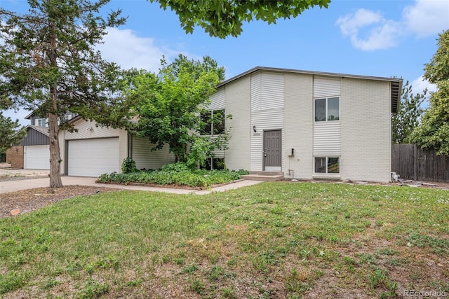 15908 E Flora Pl, Aurora, CO 80013 - view of front facade featuring a garage, brick siding, and concrete driveway