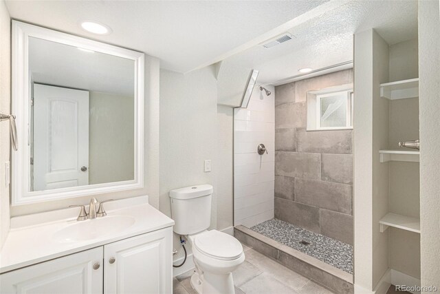15908 E Flora Pl, Aurora, CO 80013 - full bathroom with vanity, a tile shower, and recessed lighting