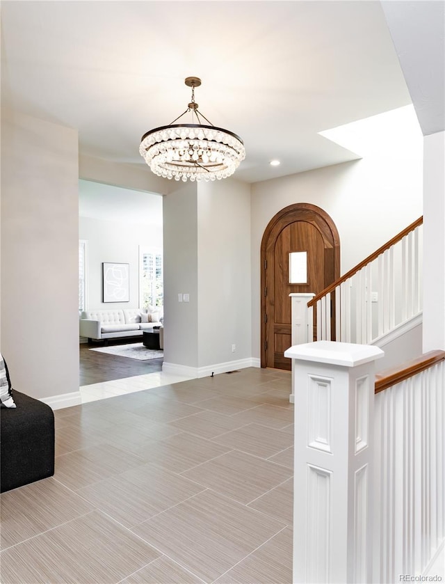 295 Jersey St, Denver, CO 80220 - foyer entrance featuring light tile patterned flooring, an inviting chandelier, stairs, recessed lighting, and baseboards