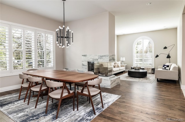 295 Jersey St, Denver, CO 80220 - dining room featuring dark wood-style flooring, baseboards, and a chandelier
