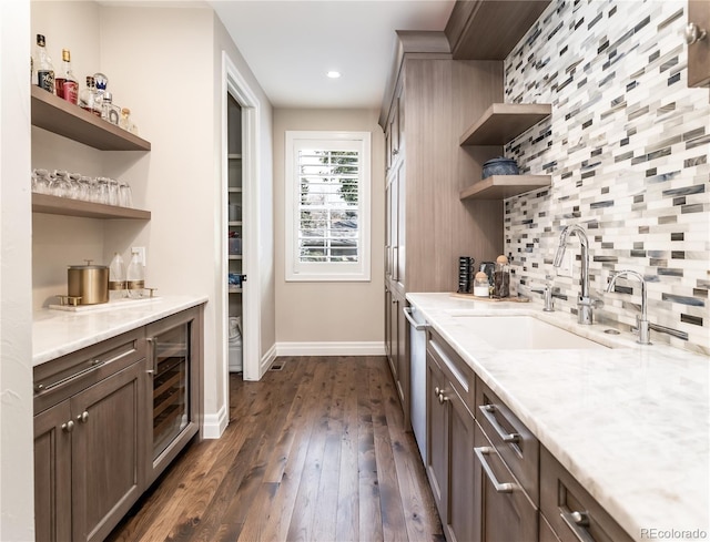 295 Jersey St, Denver, CO 80220 - bar featuring beverage cooler, baseboards, dark wood-style floors, a sink, and backsplash
