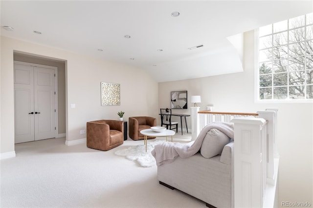 295 Jersey St, Denver, CO 80220 - carpeted living area featuring baseboards, lofted ceiling, and visible vents