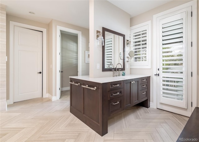 295 Jersey St, Denver, CO 80220 - bathroom featuring recessed lighting, baseboards, and vanity