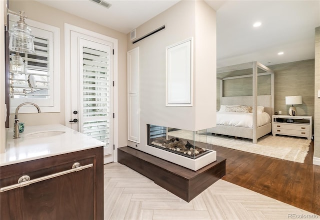 295 Jersey St, Denver, CO 80220 - ensuite bathroom with vanity, ensuite bathroom, and recessed lighting