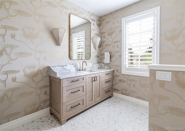 295 Jersey St, Denver, CO 80220 - bathroom with baseboards, vanity, and wallpapered walls
