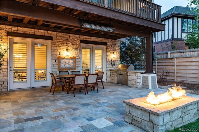 295 Jersey St, Denver, CO 80220 - view of patio / terrace featuring fence, a grill, exterior kitchen, an outdoor fire pit, and outdoor dining space