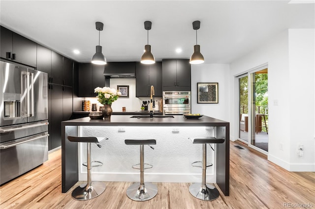 9161 W Lake Dr, Littleton, CO 80123 - kitchen featuring appliances with stainless steel finishes, dark countertops, dark cabinetry, and recessed lighting