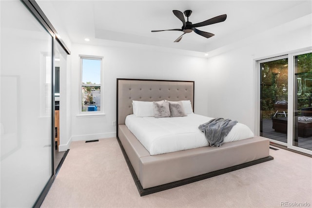 9161 W Lake Dr, Littleton, CO 80123 - carpeted bedroom featuring access to outside, multiple windows, ceiling fan, and recessed lighting