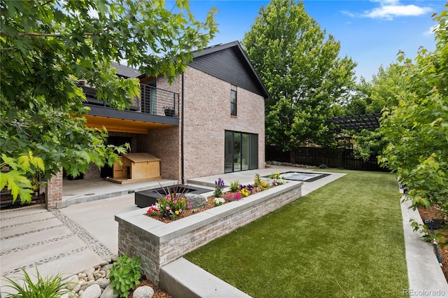 9161 W Lake Dr, Littleton, CO 80123 - rear view of house with a patio area, a balcony, and brick siding