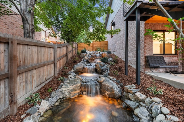 9161 W Lake Dr, Littleton, CO 80123 - view of yard featuring a small pond