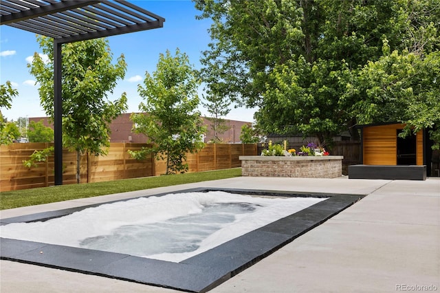 9161 W Lake Dr, Littleton, CO 80123 - fenced backyard featuring a patio, a pergola, and an in-ground hot tub