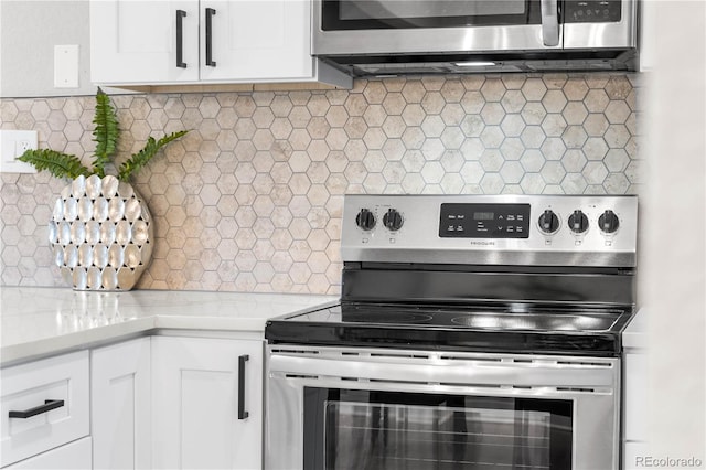 kitchen featuring light countertops, white cabinets, backsplash, and appliances with stainless steel finishes