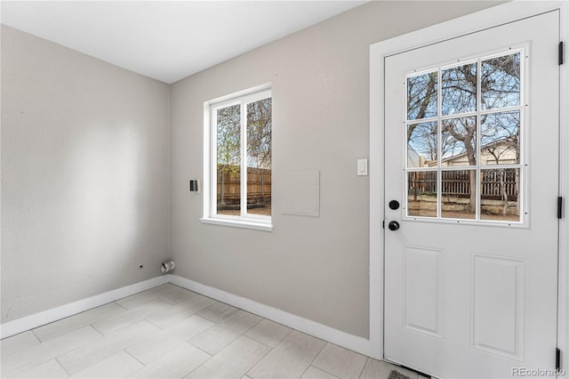 doorway with baseboards