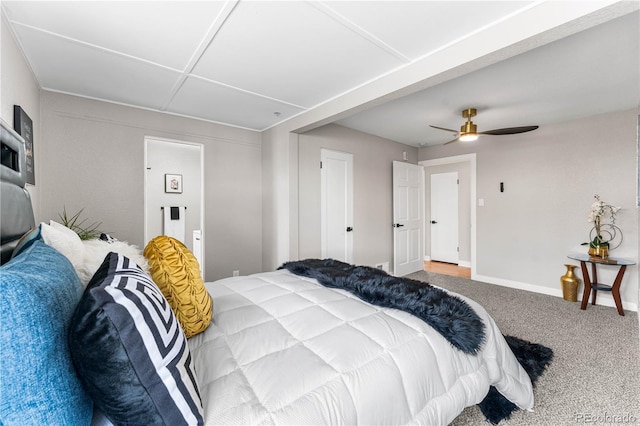 carpeted bedroom featuring baseboards and ceiling fan