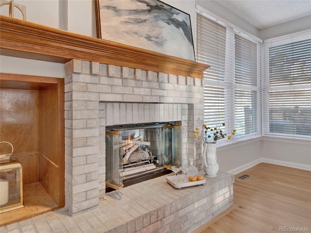 interior details with a fireplace and hardwood / wood-style flooring