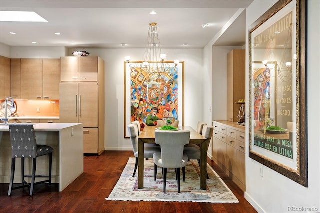 dining space with recessed lighting, baseboards, an inviting chandelier, and dark wood-style floors