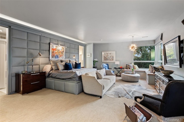 bedroom featuring light carpet and a notable chandelier