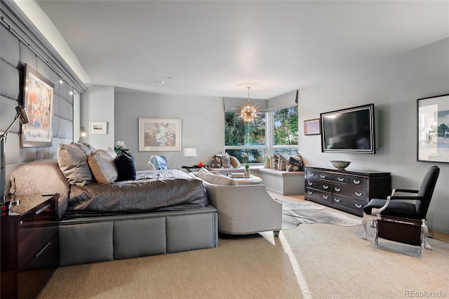 living room featuring carpet and an inviting chandelier